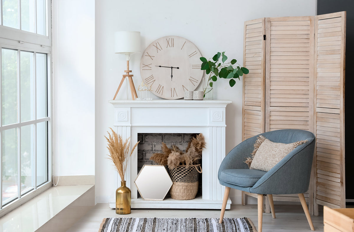 Wall clock located in modern living room with accent chair and lamp