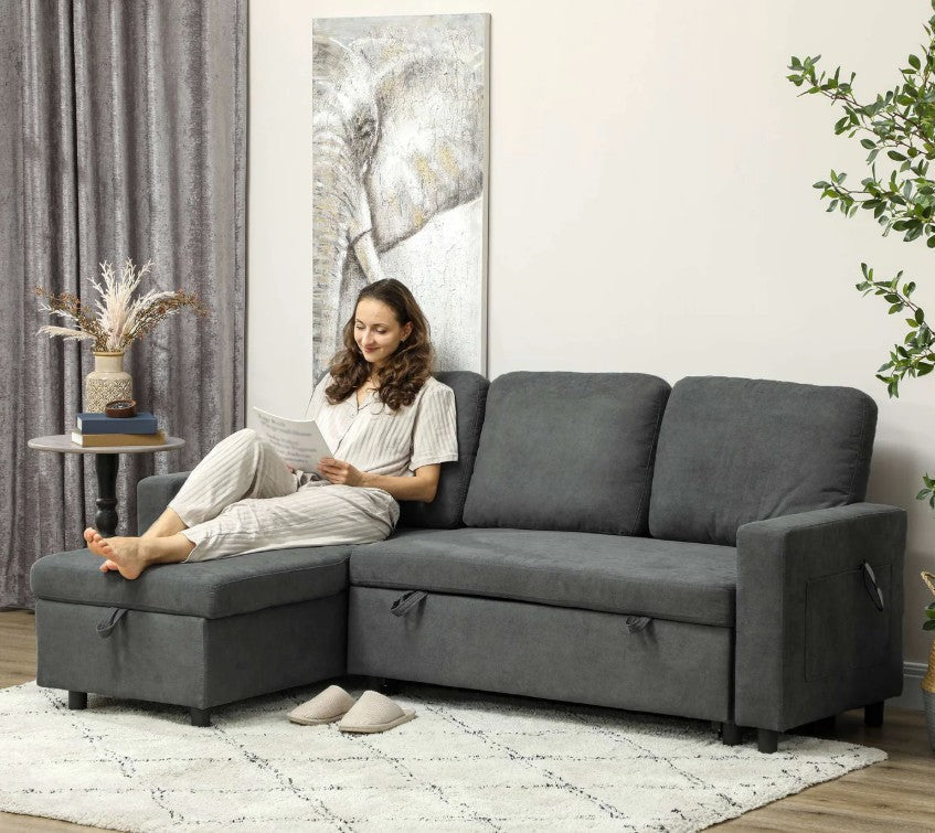 grey sofa bed folded out in living room